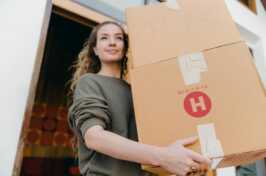 photo of woman moving house